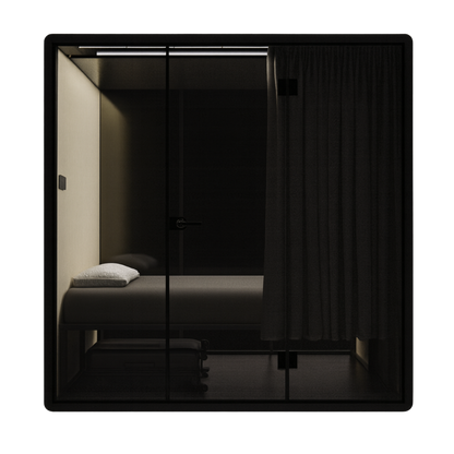 Soundproof First Class black NapBox Sleeping Pod - front view with bed, luggage storage, control panel, and privacy curtain.